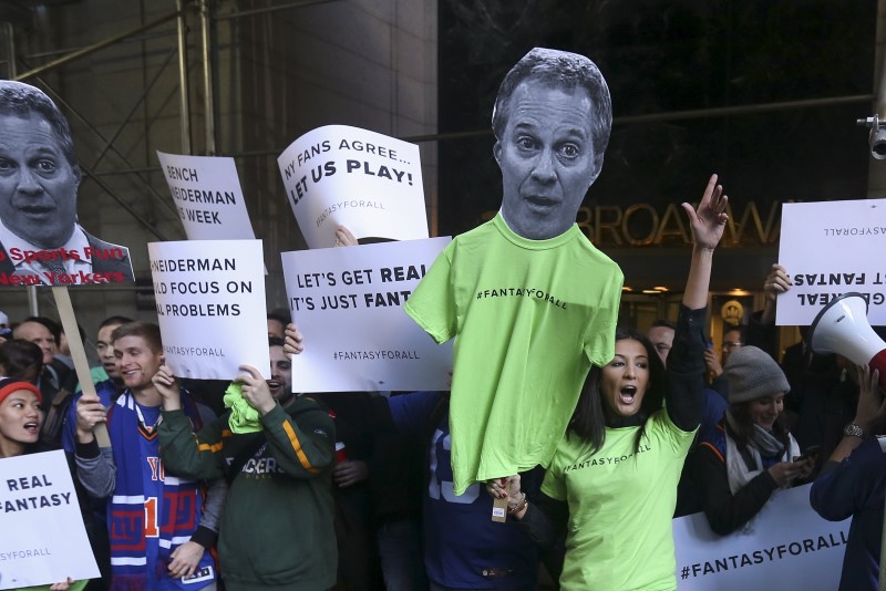 People protest in front of New York Attorney General Eric Schneiderman's office following his decision to shut down fantasy sports sites FanDuel and DraftKings, in the Manhattan borough of New York November 13, 2015. REUTERS/Carlo Allegri