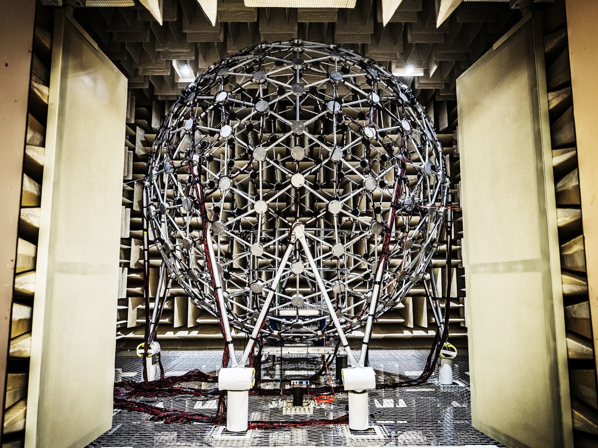“The Air Force Research Lab's test facility aims 277 loudspeakers in a 14-foot sphere toward a test stand, where a subject or sensor array sits.” Photo credit: