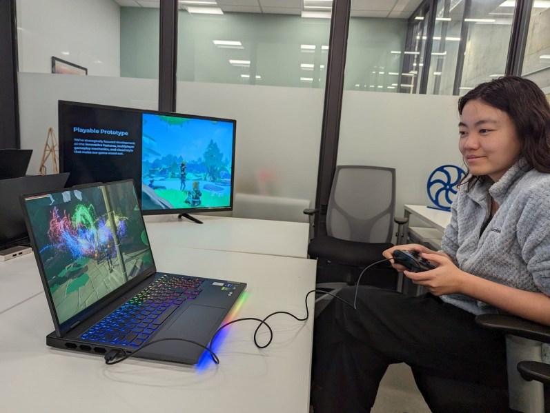 Shan Shan of Lightspeed Venture Partners plays Gardens' game at GDC.