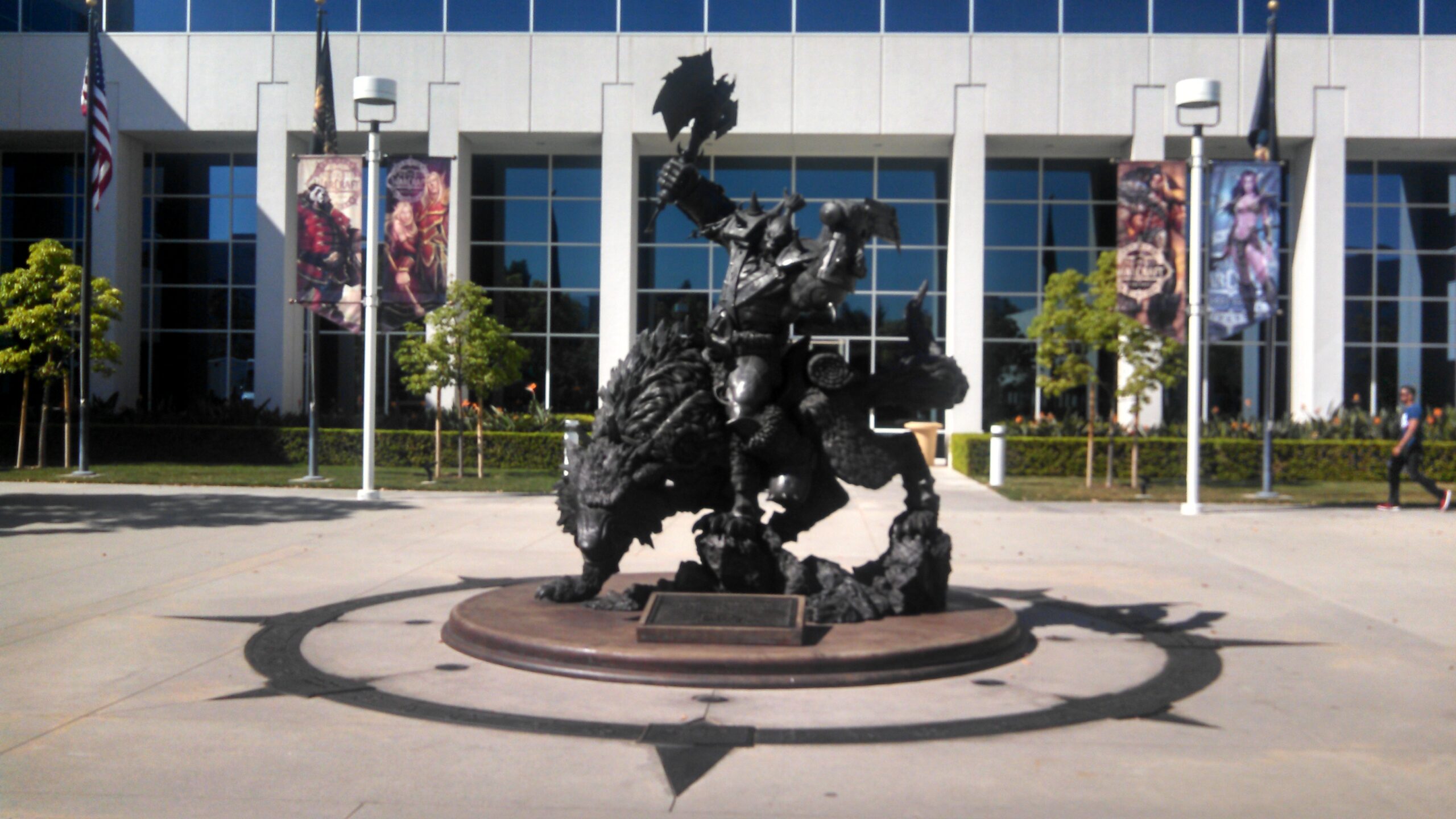 An orc rider guards the door at BlizzCon headquarters, surrounded by a compass rose of the company's core values.