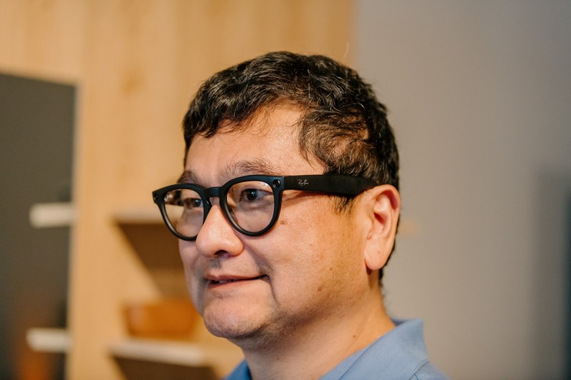 Ray-Ban Meta smart glasses on the head of a guy with messy hair.