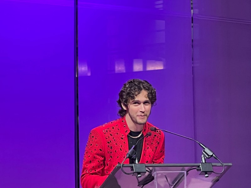 Cameron Kostopoulos accepts Best XR for Change game at Games for Change 2023.