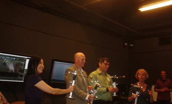 Visitors hold props with infrared markers in DreamWorks Animation's visualization room.