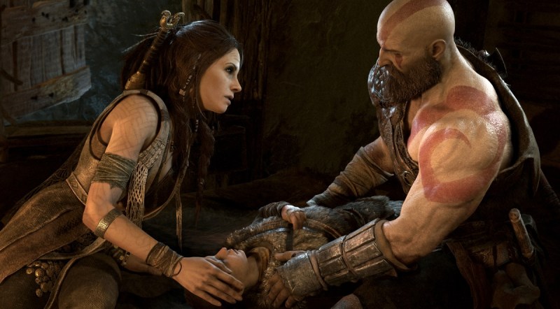 Freya and Kratos with an ailing Atreus in God of War.