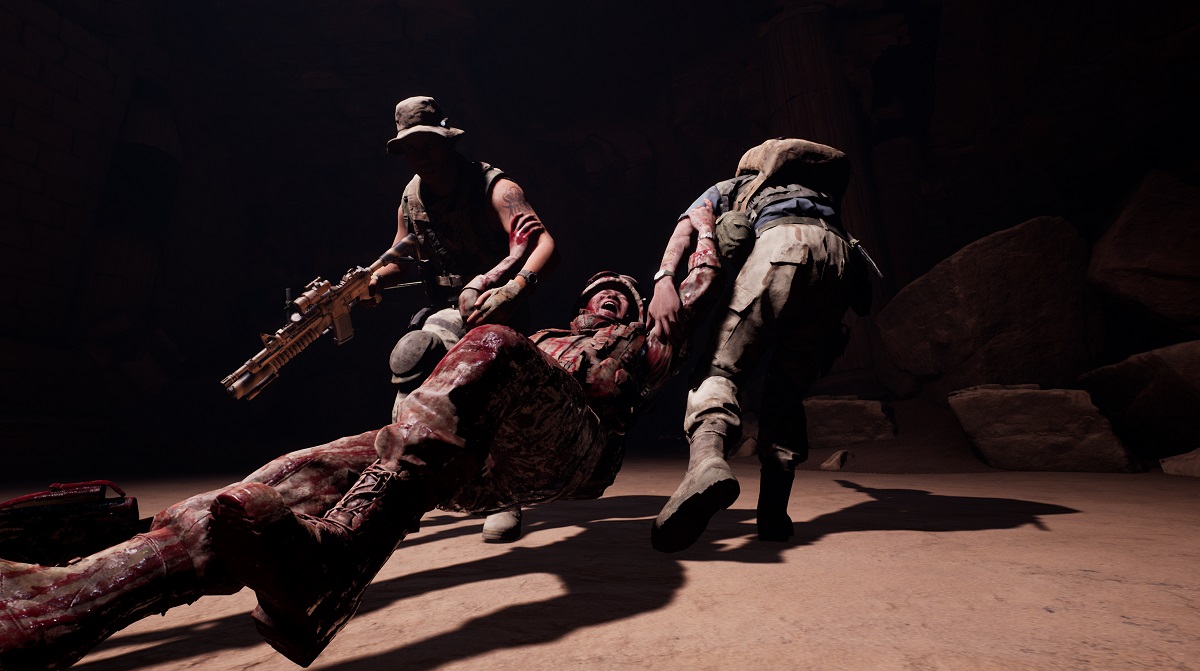 Nick and Jason drag a wounded solder to safety in The Dark Pictures Anthology: House of Ashes.