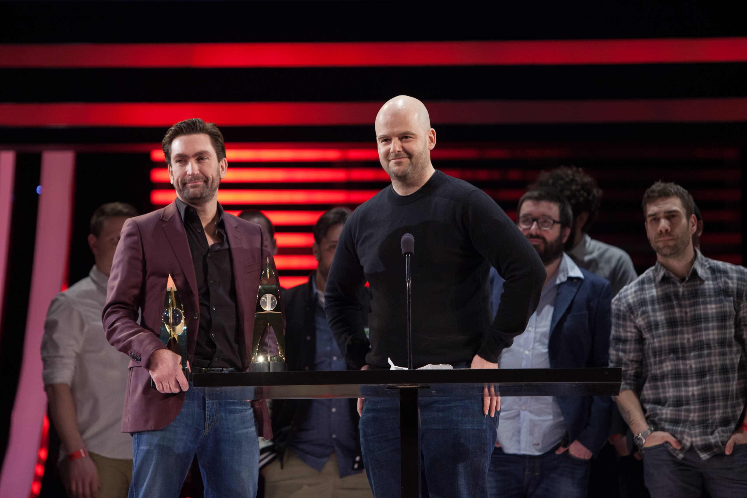 Leslie Benzies and Dan Houser accepting an award.