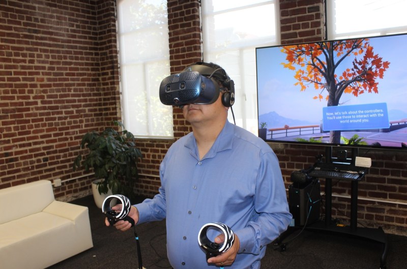 Dean Takahashi models the HTC Vive Cosmos.
