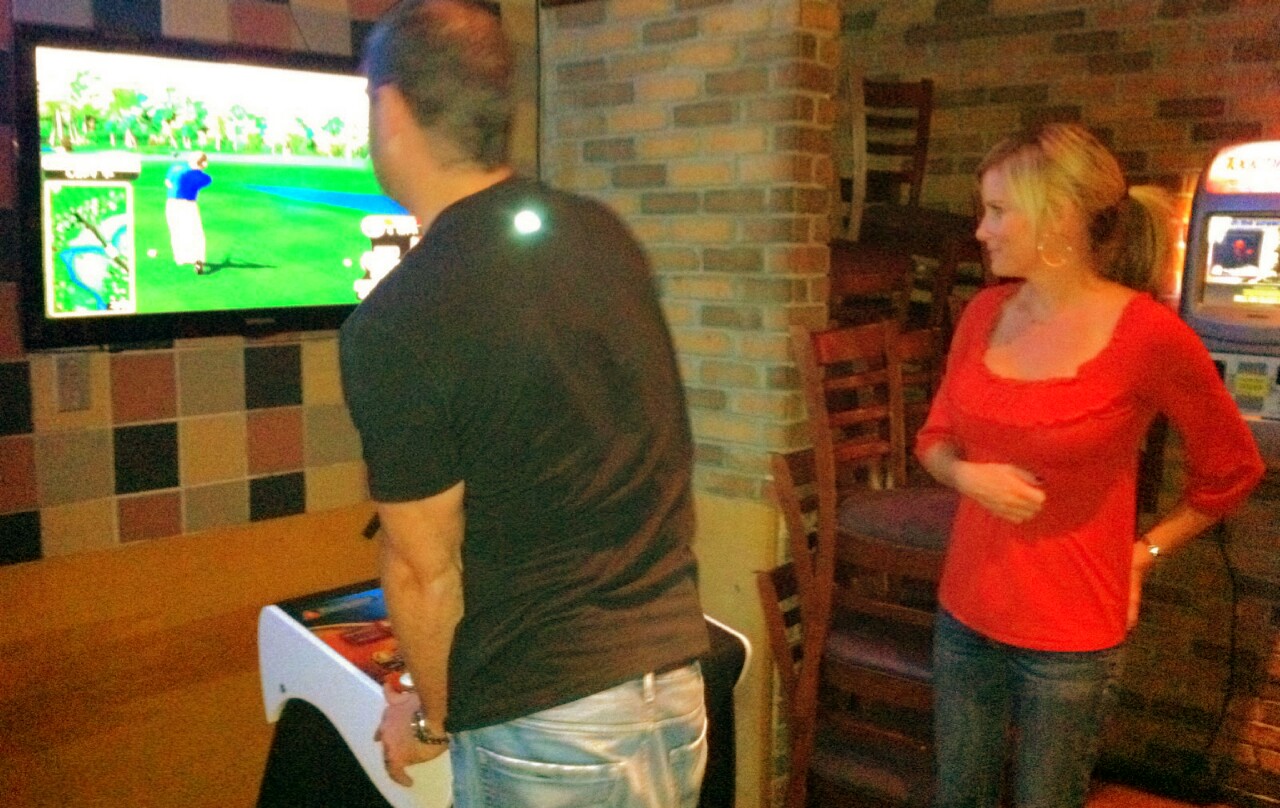 Douche playing Golden Tee Golf