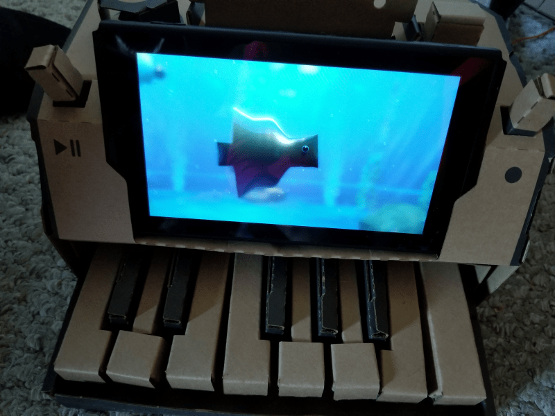 Custom fish swimming in aquarium, shown on Nintendo Labo piano