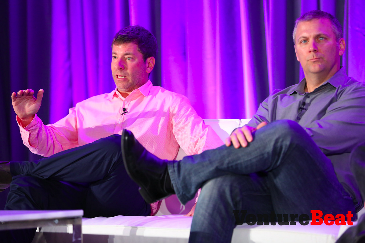 Peter Levin, left, president of interactive ventures and games at Lionsgate, speaks with Chris Petrovic, head of corporate development at Kabam, at VentureBeat's 2014 GamesBeat conference.