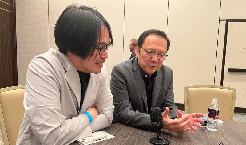 Hidetaka Miyazaki (right) and his translator after winning Game of the Year at the Dice Awards.