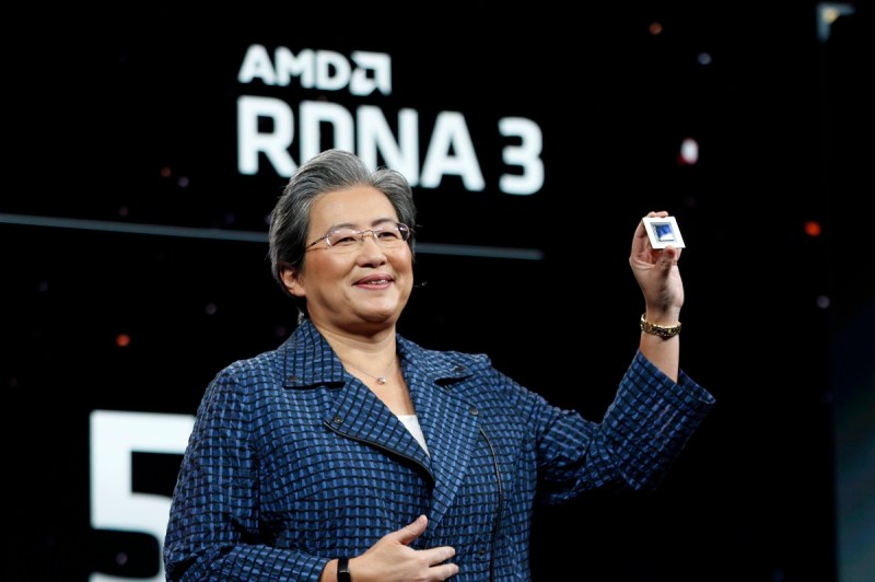 Lisa Su holds up AMD's first chiplet graphics chip Radeon 7900 XTX