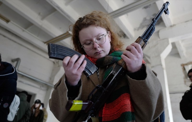 A child loading a weapon in Ukraine.