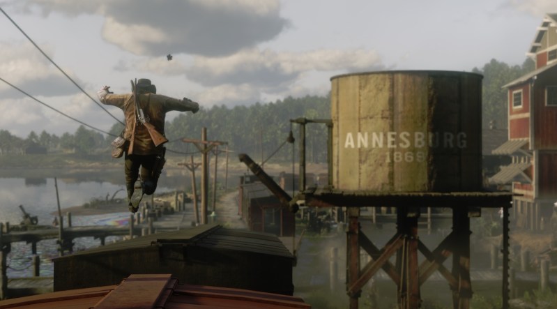 Arthur Morgan hops cars on a train he is robbing.