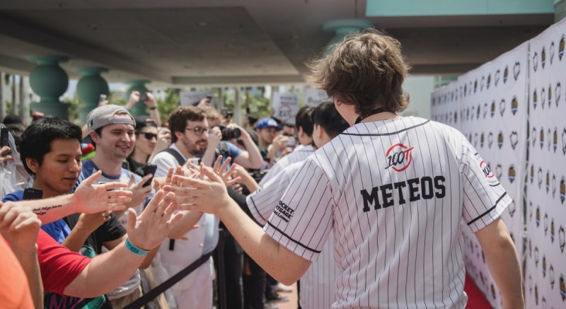 Members of 100 Thieves League of Legends esports team greet fans.