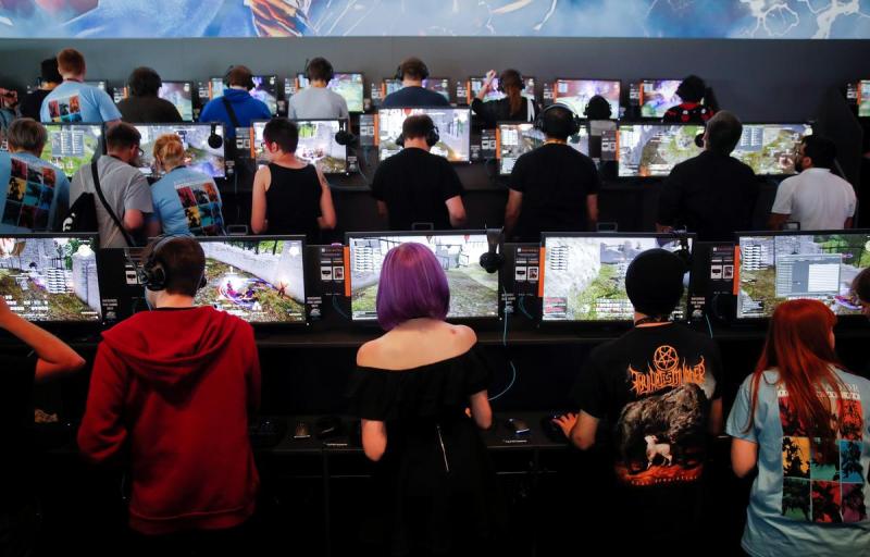 Gamers play video games during the opening of the world's largest computer games fair Gamescom in Cologne, Germany, August 22, 2017.