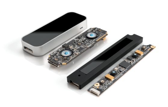The original Leap, its circuit board, the new embeddable Leap, and its circuit board