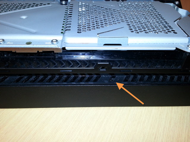 You can find the screen just below one of the PS4's interior ridges.