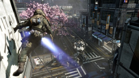 A soldier runs on a wall in a 1-on-1 battle with a mech unit.