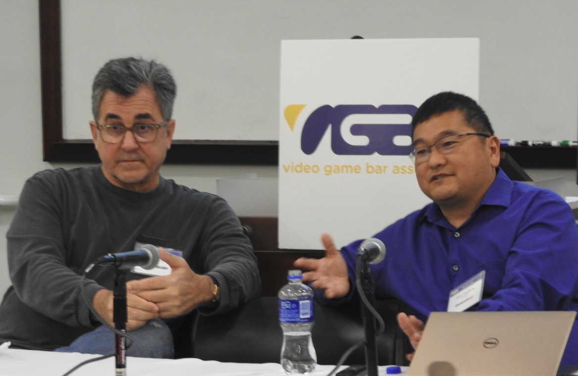 Michael Pachter of Wedbush Securities and Dean Takahashi of GamesBeat at the Video Game Bar Association.
