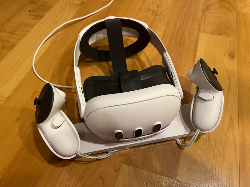 The Meta Quest 3 with Elite Strap on its charging dock.