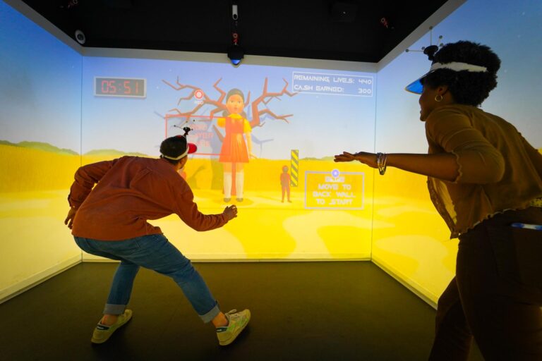 Two players attempt to not be murdered by moving when the giant child turns