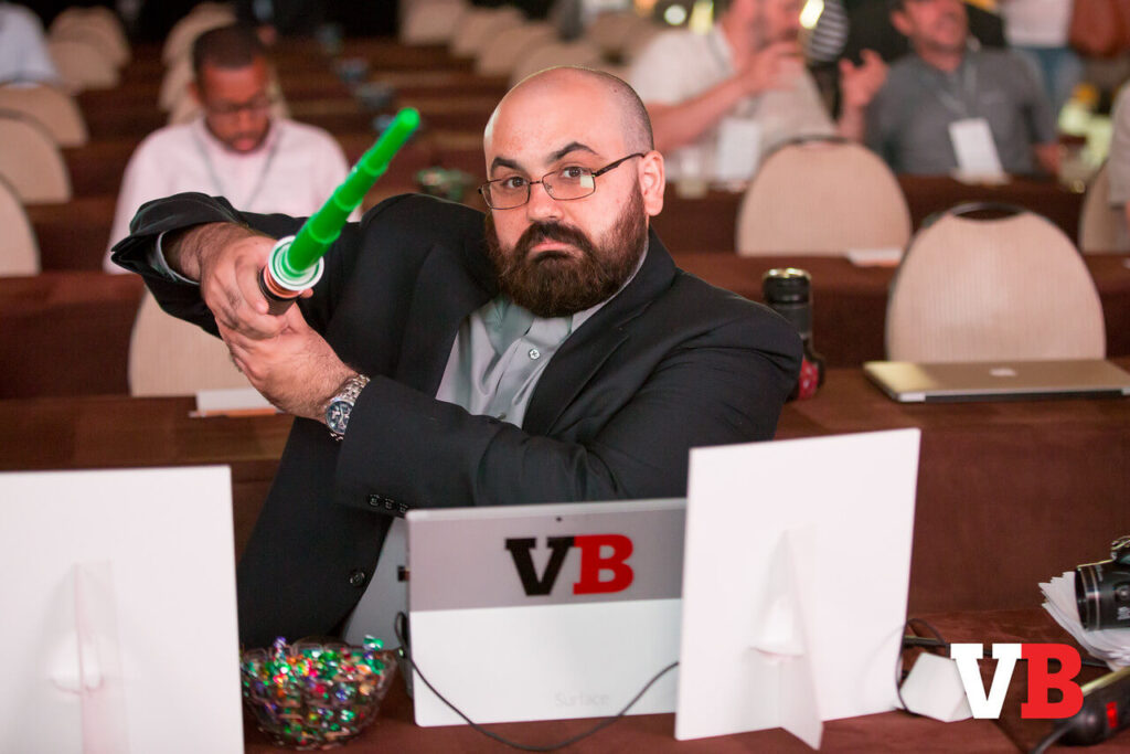 A decade ago, Mike Minotti hams it at the media table. Want to join him?
