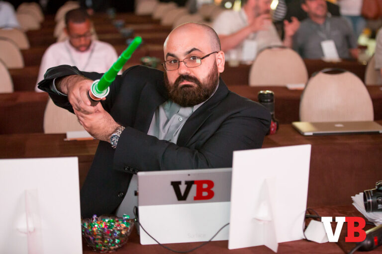 A decade ago, Mike Minotti hams it at the media table. Want to join him?