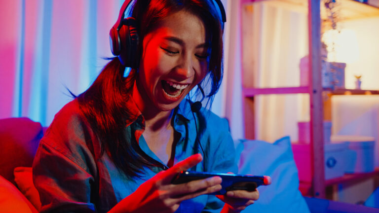 person using cellphone and smiling