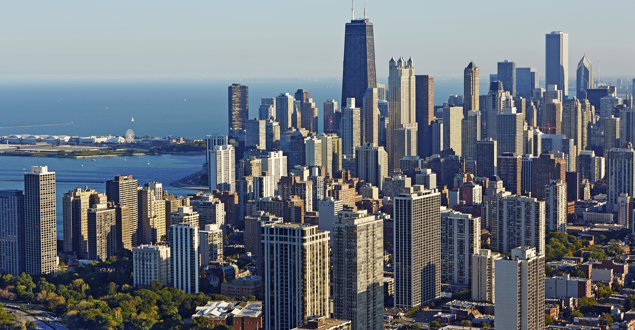 Aerial panoramic cityscape of Downtown Chicago with the shoreline of Lake Michigan.