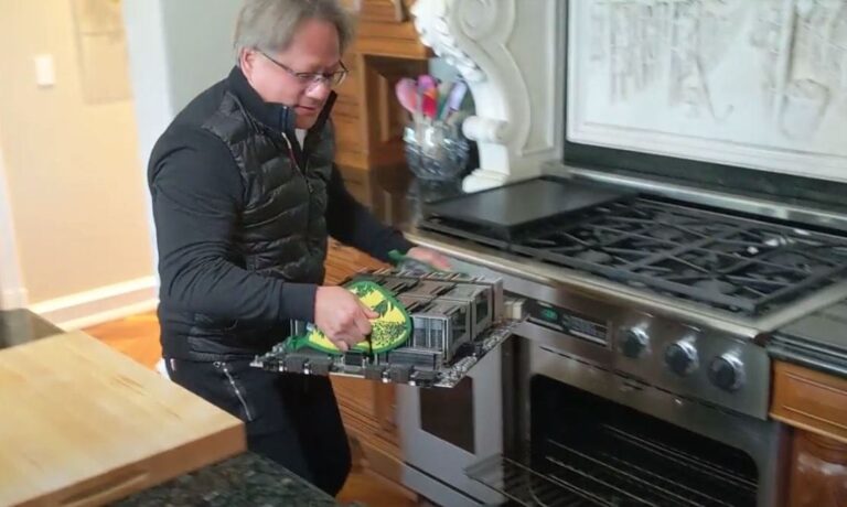 Jensen Huang of Nvidia holds the world's largest graphics card.