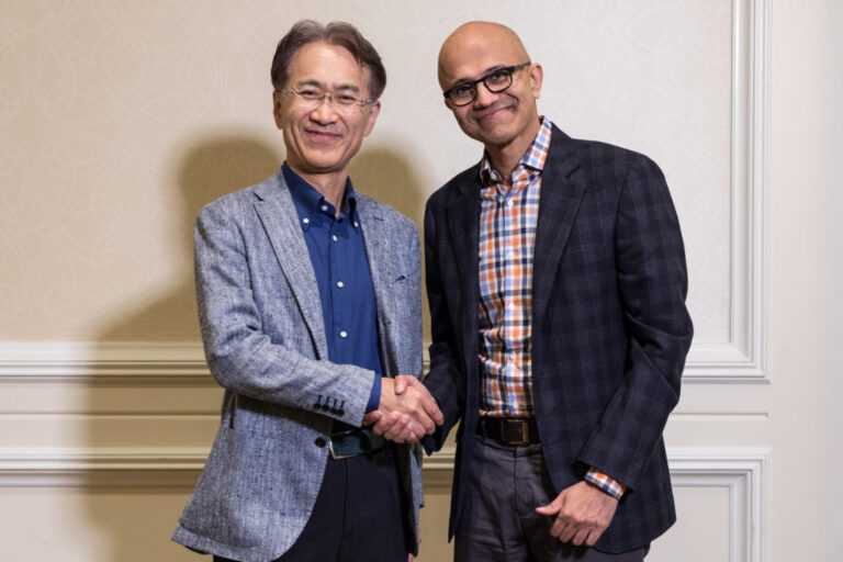 Sony CEO Kenichiro Yoshida (left) shakes hands with Microsoft CEO Satya Nadella.