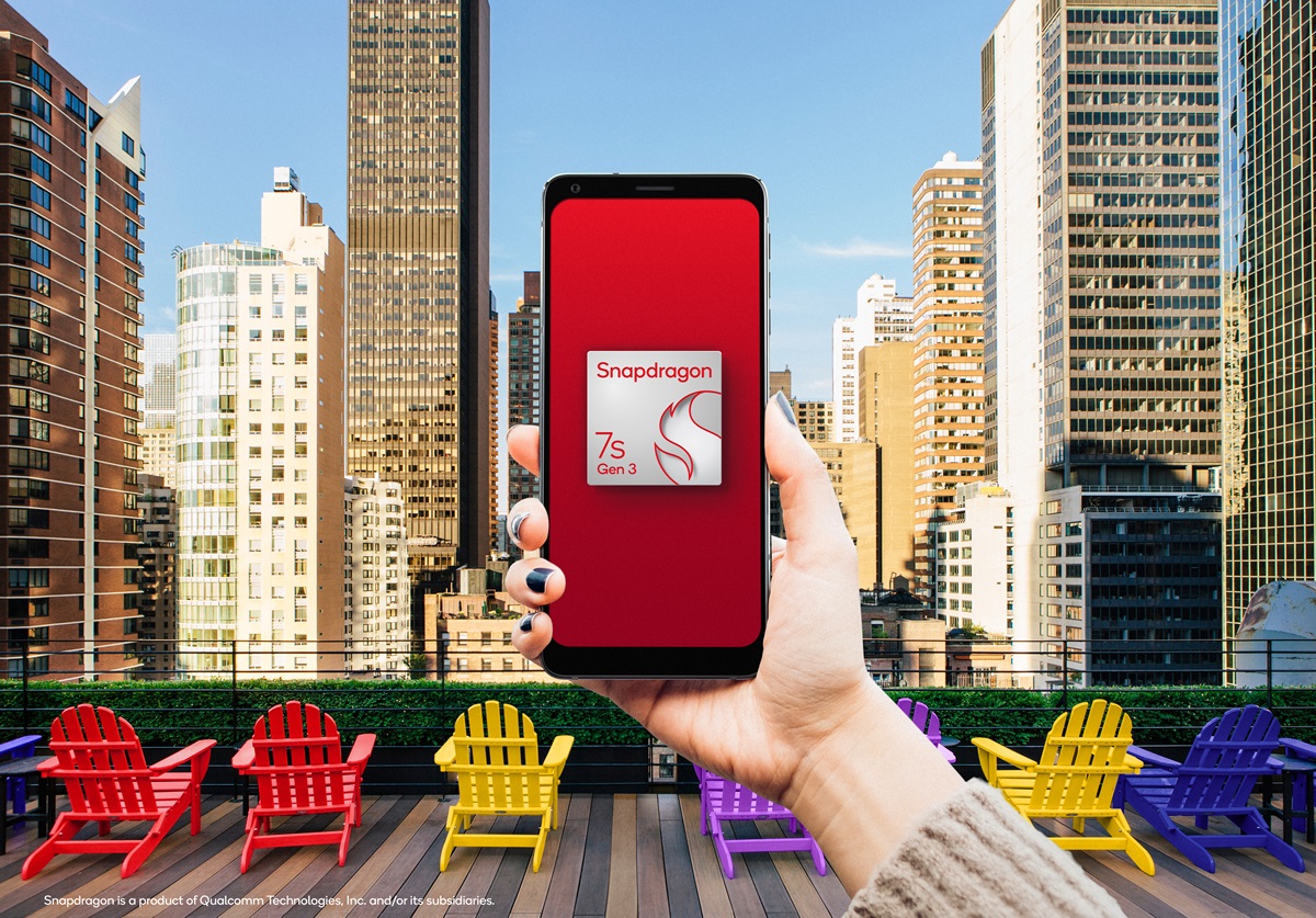 View of Manhattan from a New York City rooftop with colorful deck chairs.