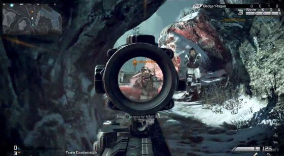 Looking down a rifle's scope in Call of Duty: Ghosts.
