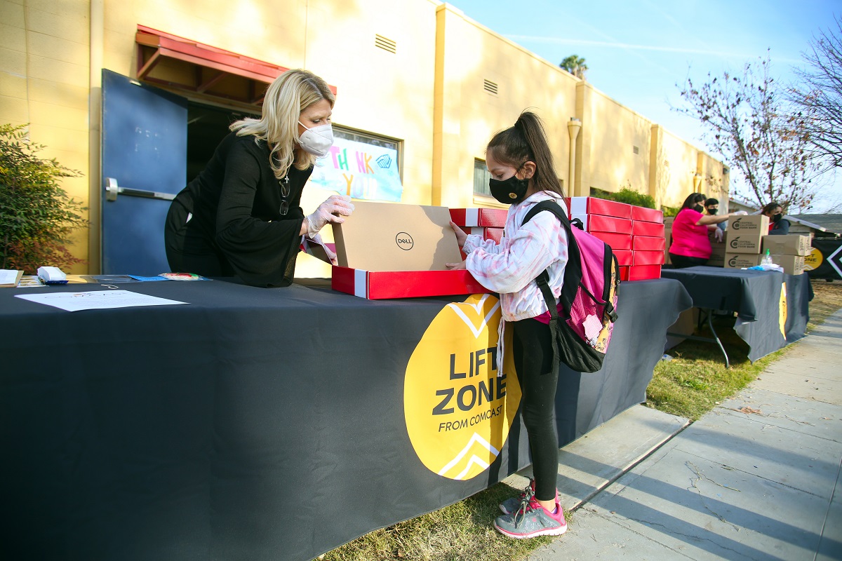 Comcast Internet Essentials, Central Valley Lift Zones announcement, where families received a laptop, 12 months of internet and a box of food items at the Boys and Girls Clubs of Fresno County on Tuesday Dec 12, 2020 in Fresno, Calif.