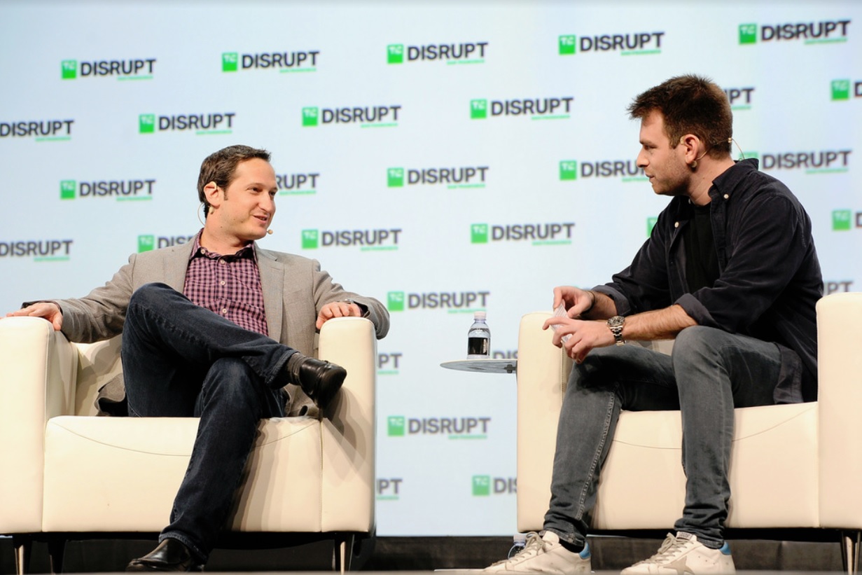 DraftKings CEO Jason Robins (left) speaks with Techcrunch writer Fitz Tepper.