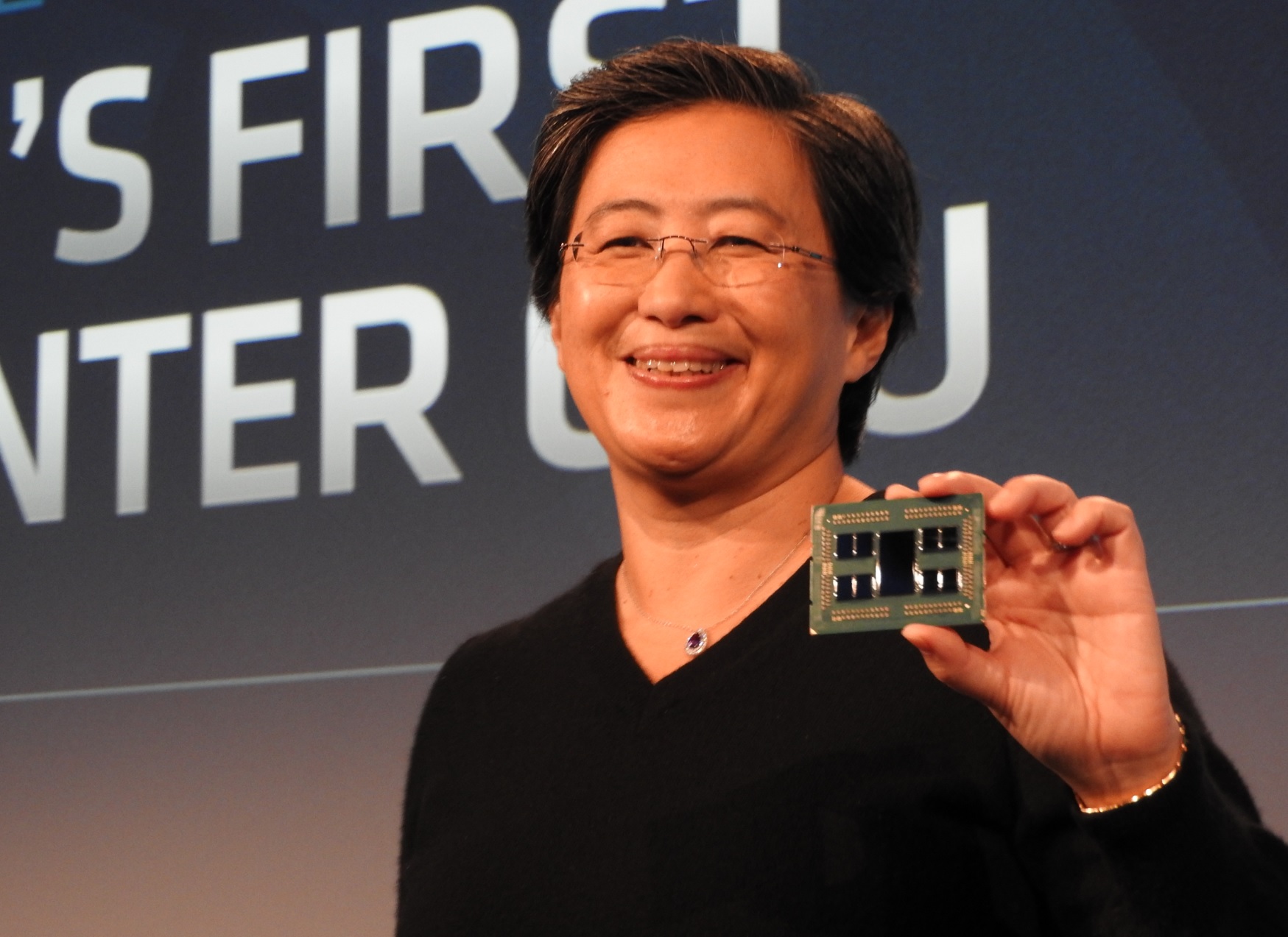 Lisa Su, CEO of AMD, holds an Epyc Rome server module.