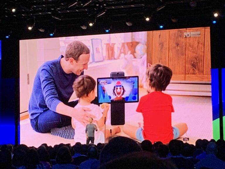 Mark Zuckerberg uses Portal to show an AR app to his kids. His mother is reading them a bedtime story.