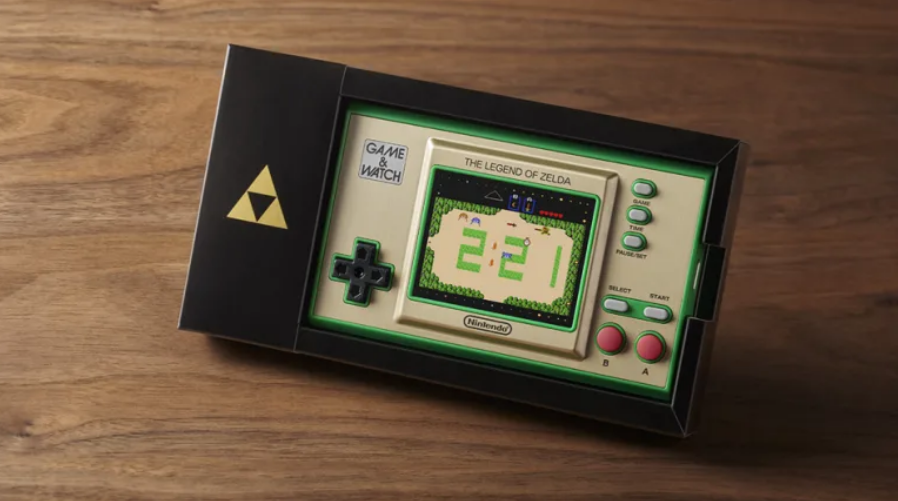 The Zelda Game & Watch with its included cardboard display stand.