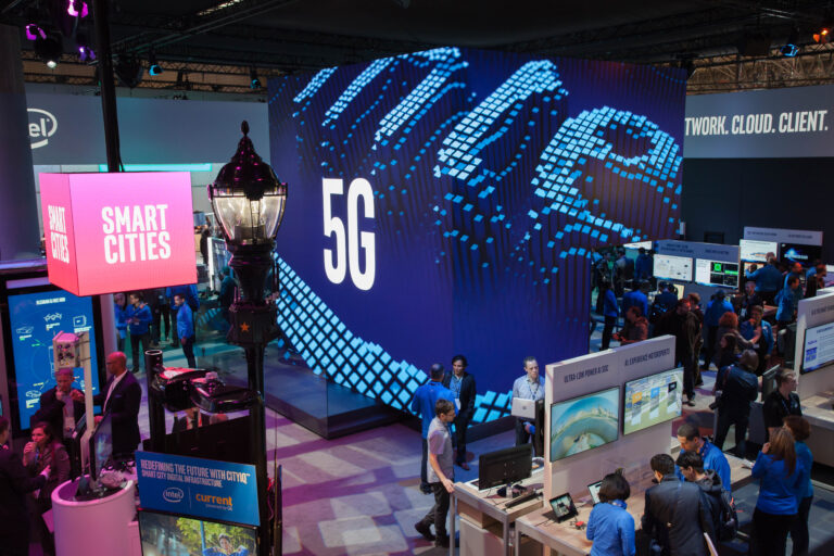 Visitors tour the Intel booth on Monday, Feb. 26, 2018, at Mobile World Congress.
