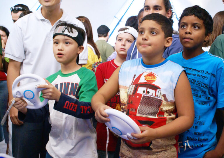 Kids playing Mario Kart