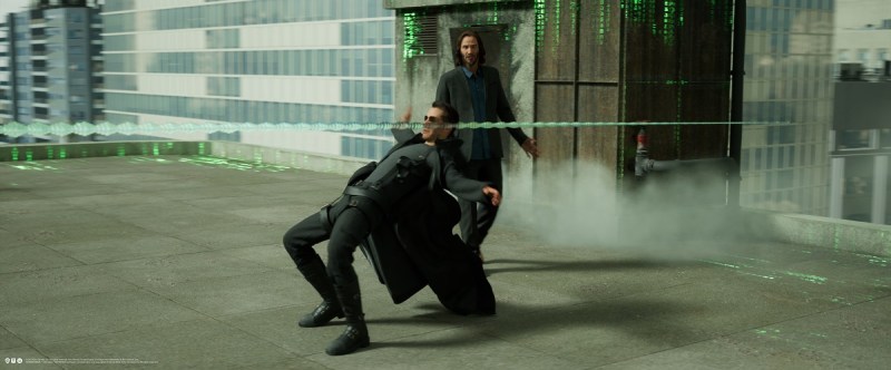 A real Keanu Reeves walks into a simulated scene.
