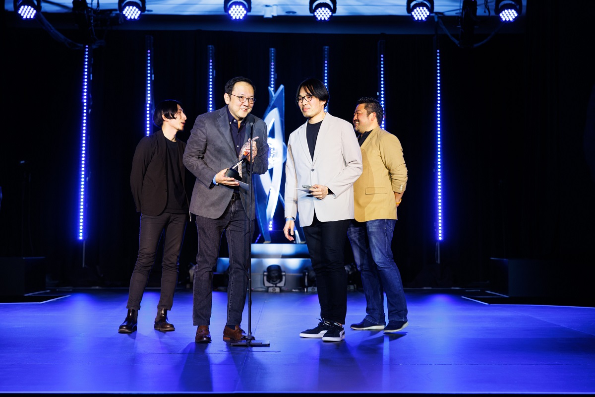 Hidetaka Miyazaki and the From Software team accept the award for Game of the Year at the Dice Awards.