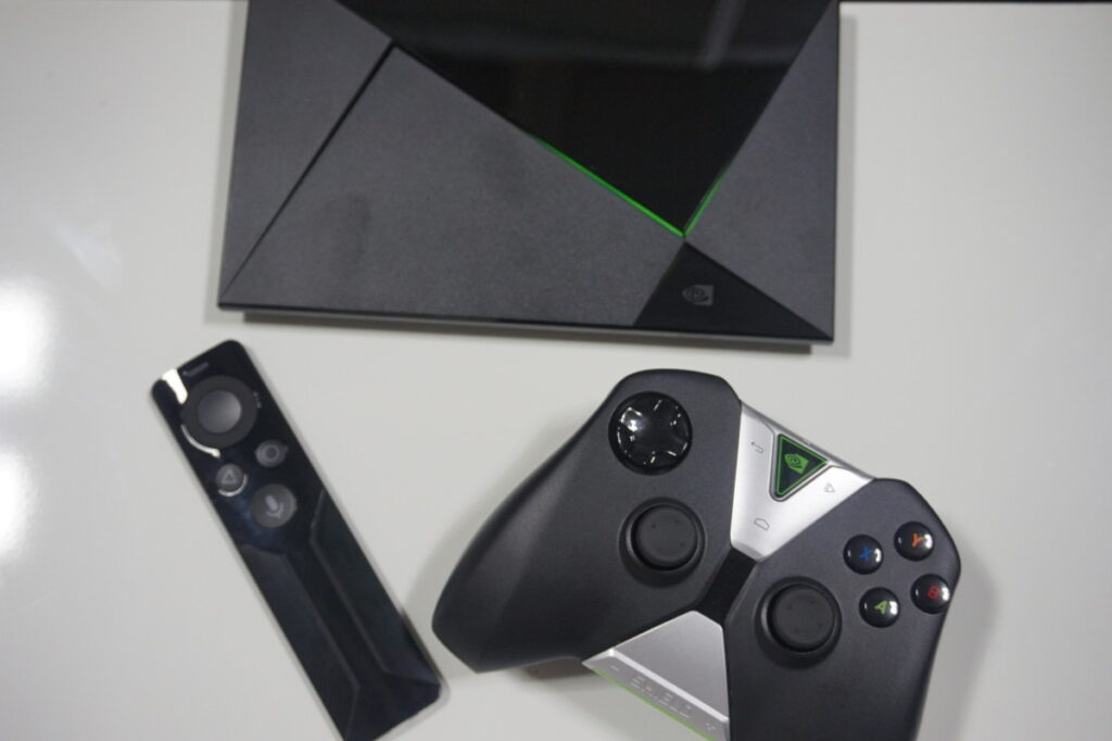 The Nvidia Shield microconsole with remote and gamepad.
