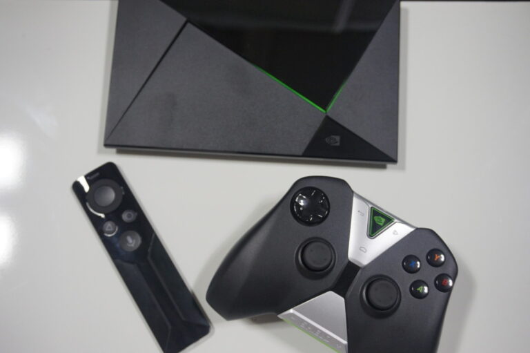 The Nvidia Shield microconsole with remote and gamepad.