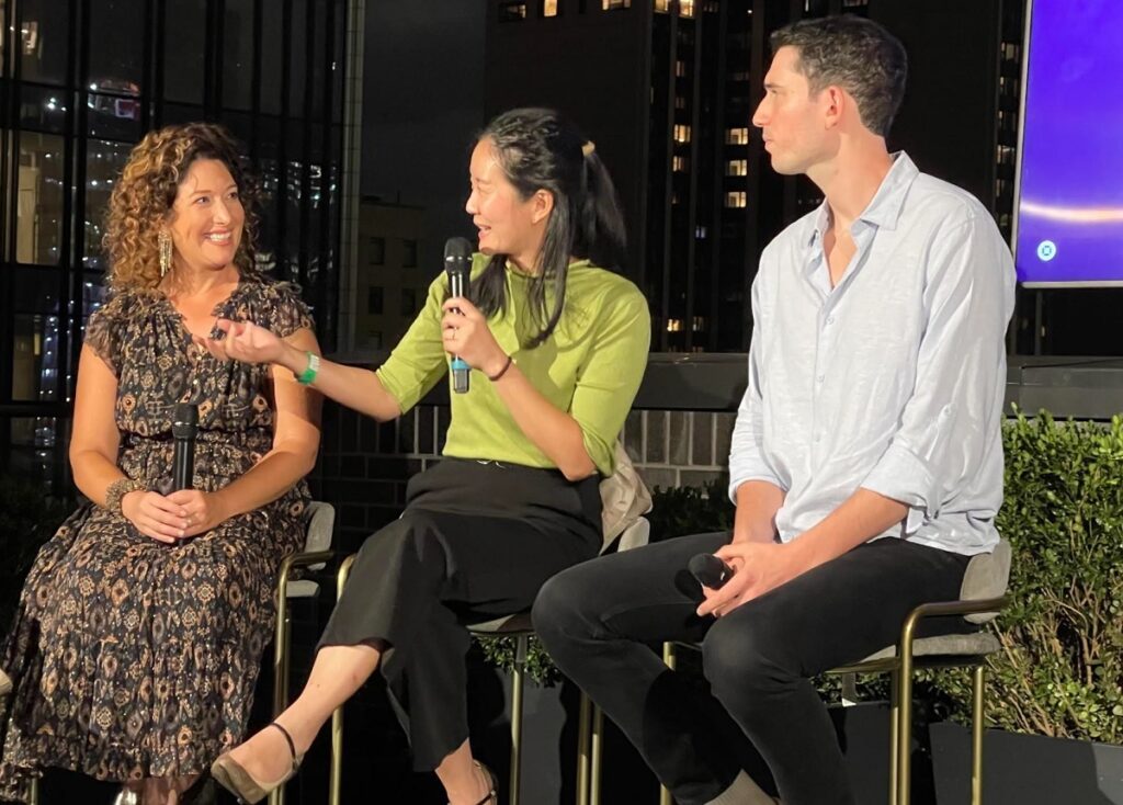 Randi Zuckerberg (left) speaks with Okcoin CEO.