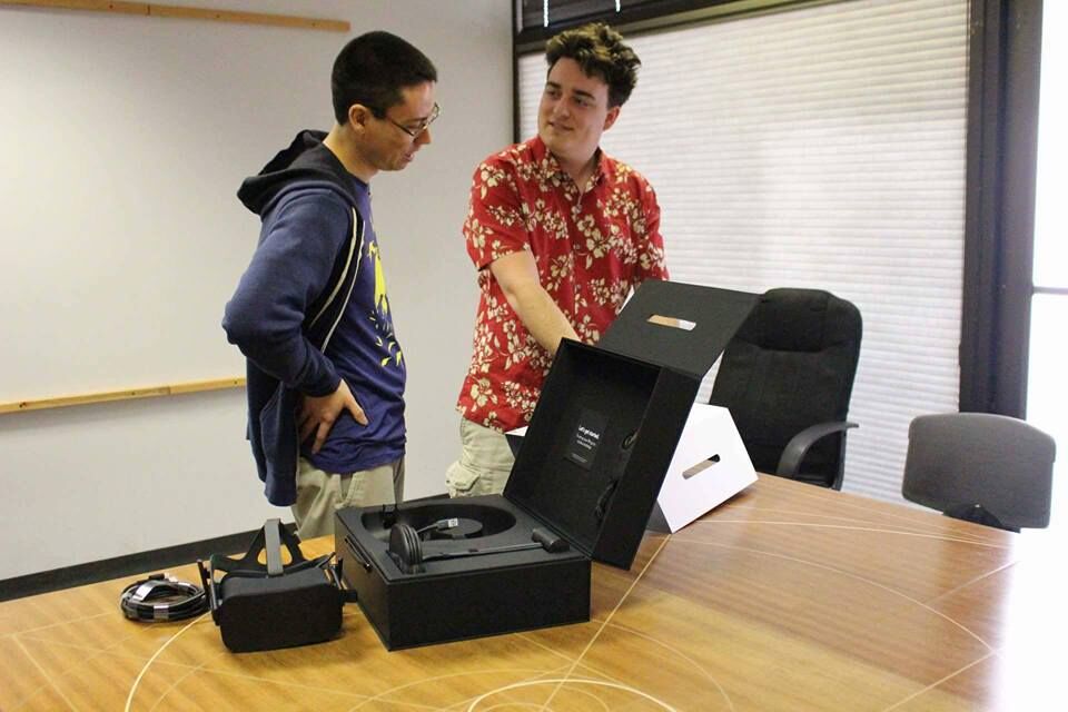 Palmer Luckey (right) delivers the first Oculus Rift.