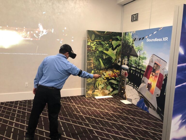 Dean Takahashi demos a Qualcomm XR virtual reality headset.