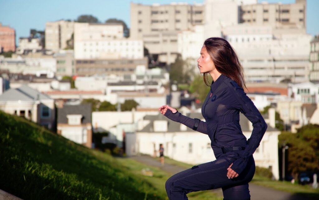 An actress wears a Rokoko SmartSuit for motion capture.