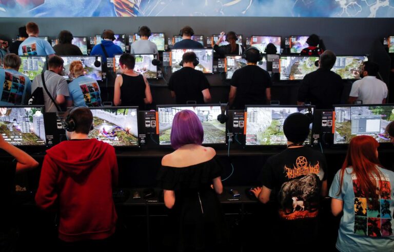 Gamers play video games during the opening of the world's largest computer games fair Gamescom in Cologne, Germany, August 22, 2017.
